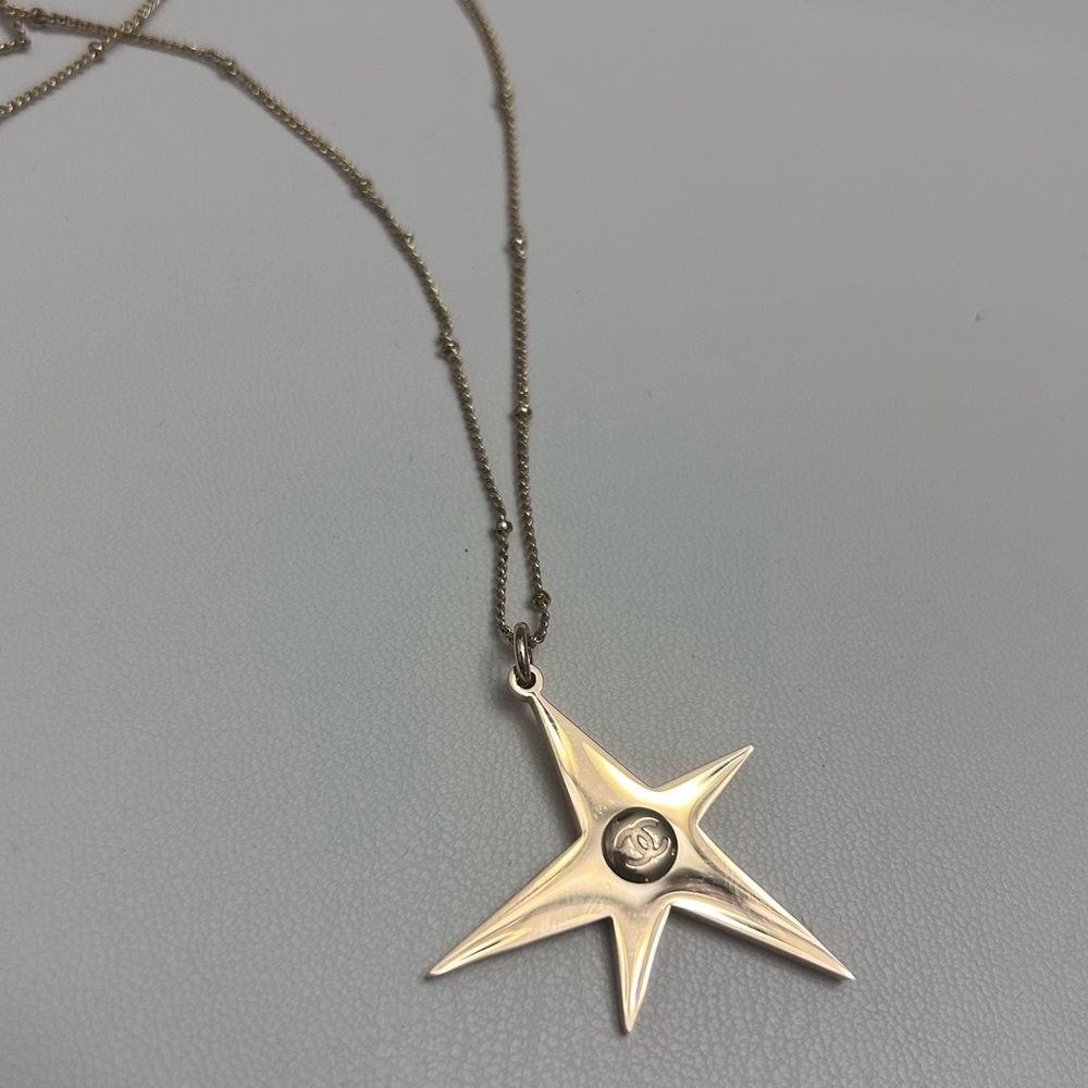 Chanel Beauty Gold Star Pendant on House of Harlow Chain Necklace
